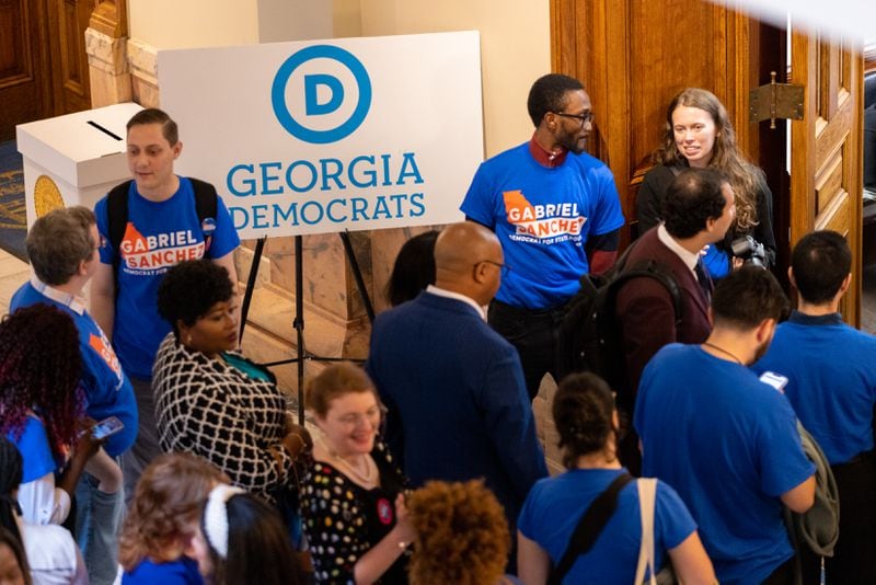 Democrats line up to sign paperwork to run for election at the Capitol. The qualifying period for legislative and congressional races closed Friday. (Arvin Temkar / arvin.temkar@ajc.com)