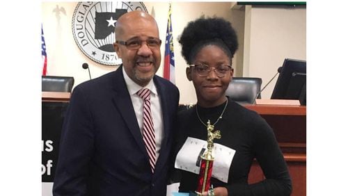 Douglas County School System school chief Trent North, shown here with Chisa Ihekwereme, the 2020 winner of the Douglas County Spelling Bee, has been named a finalist for national superintendent of the year. (Courtesy photo)
