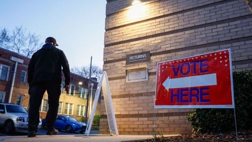 A person walks into the Joan P. Garner Library at Ponce De Leon as the polls open for Georgia for the presidential primary on Tuesday, March 12, 2024. Miguel Martinez/The Atlanta Journal-Constitution/TNS)