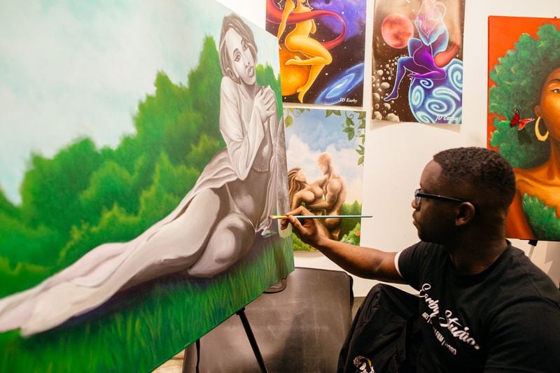 Artist JD Earby works on an original piece during "A Marvelous Black Boy Art Show." Courtesy of Bosa LaNova