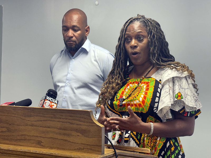 Teresa Haley, a consultant, activist and former president of the Springfield branch of the NAACP, reacts as she speaks, Wednesday, Aug. 14, 2024, in Springfield, Ill, at right is Sontae Massey, cousin of Sonya Massey, a 36-year-old black woman who was shot by a sheriff's deputy in her home after she called 911 for help. (John O'Connor/AP)