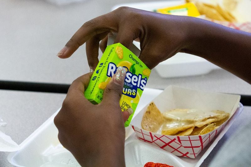 Students at Hickory Hills Elementary School in Marietta, Georgia, enjoy their lunch on Tuesday, Jan. 21, 2020. Many children in Georgia still cannot afford the standard lunch and either accrue lunch debt or are fed an alternate meal. (