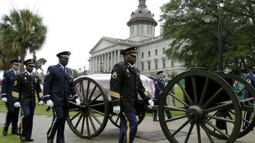 The casket of U.S. Sen. Strom Thurmond, R-S.C., leaves the South Carolina Statehouse, Tuesday, July 1, 2003, for funeral services at the First Baptist Church in Columbia, S.C. (Photo: Bruce Flashnick / Associated Press 2003)