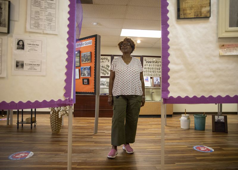 Alma Jean Carney-Thomas, a local historian, civil rights activist, and entrepreneur who brought the first health clinic to Haywood County, stands for a portrait at the Dunbar Carver Museum in Brownsville, Tenn., on July 10, 2024. As a kid, she witnessed her grandmother lying in a hospital bed in the basement of the Haywood County Memorial Hospital, built in 1930 during Jim Crow. “I just remember looking around, and it didn’t look like nothin’ that I had seen in a book about a hospital,” she recalls. (Ariel J. Cobbert/Capital B, CatchLight Local via AP)