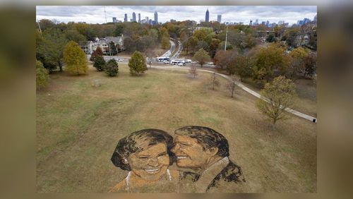 A portrait of Rosalynn and Jimmy Carter made from mulch, peat moss and stones sits on a hill in Freedom Park in Atlanta on Wednesday, Nov. 22, 2023.   (Ben Gray / Ben@BenGray.com)