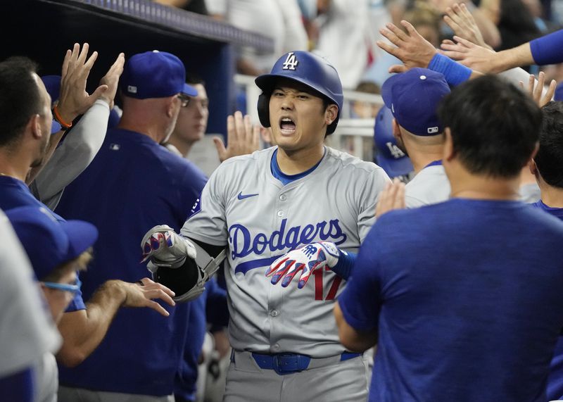 Los Angeles Dodgers' Shohei Ohtani (17) celebrates after hitting a two-run home run during the third inning of a baseball game against the Miami Marlins, Tuesday, Sept. 17, 2024, in Miami. (AP Photo/Marta Lavandier)