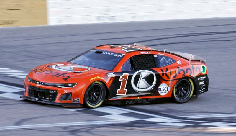 Ross Chastain crosses the finish line to win a NASCAR Cup Series auto race at Kansas Speedway in Kansas City, Kan., Sunday, Sept. 29, 2024. (AP Photo/Colin E. Braley)