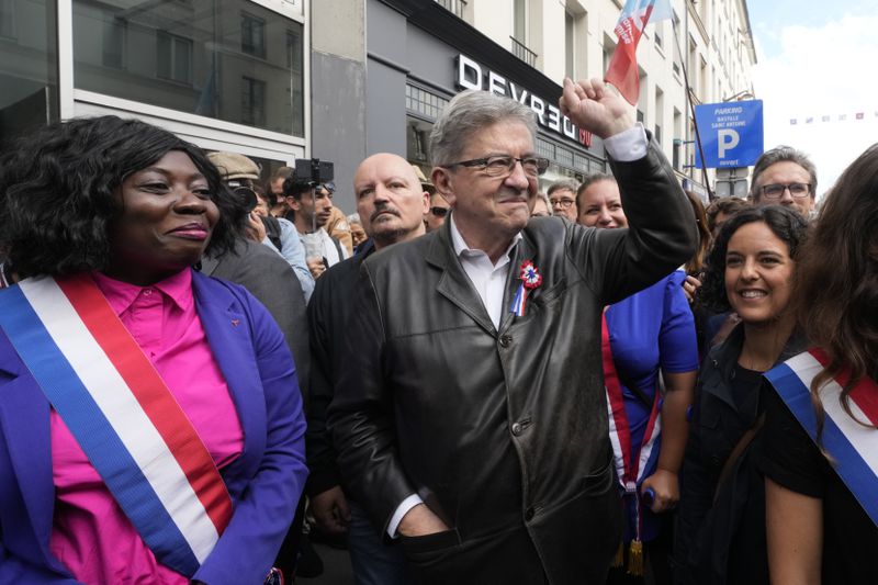 France Unbowed leader Jean-Luc Melenchon, center, who criticized as a power grab the president's appointment of a conservative new prime minister, Michel Barnier, gestures as he participates in a protest demonstration in Paris, France, Saturday, Sept. 7, 2024. (AP Photo/Michel Euler)