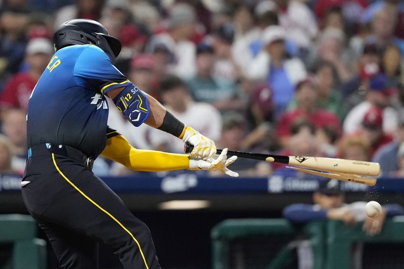 Philadelphia Phillies' Kyle Schwarber breaks his bat on a foul ball against Atlanta Braves pitcher Reynaldo López during the fifth inning of a baseball game, Friday, Aug. 30, 2024, in Philadelphia. (AP Photo/Matt Slocum)