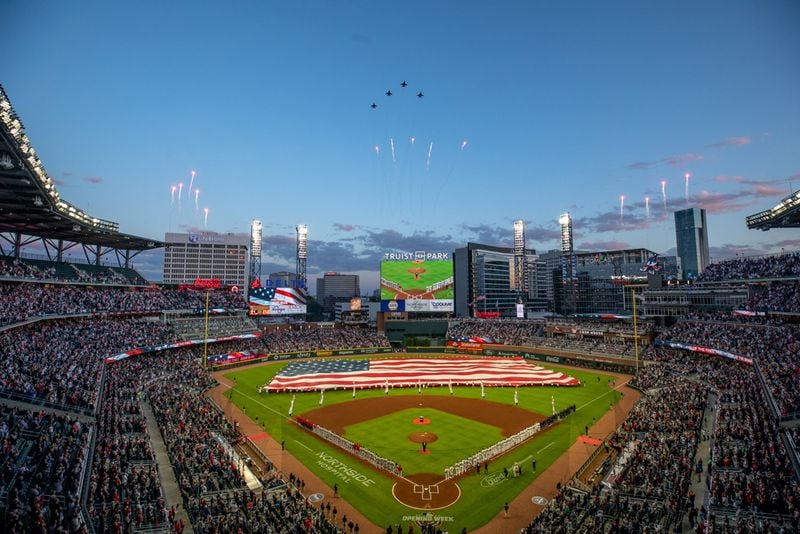 F-16 Eagles fly over before a game between the Atlanta Braves and Cincinnati Reds at Truist Park on Thursday, April 7, 2022, in Atlanta.  Branden Camp/For the Atlanta Journal-Constitution