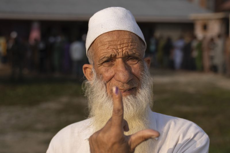 Abdul Ahad lone shows the indelible ink mark on his index finger after casting his vote in the outskirts of Srinagar, Indian controlled Kashmir, Wednesday, Sept. 25, 2024. (AP Photo/Dar Yasin)