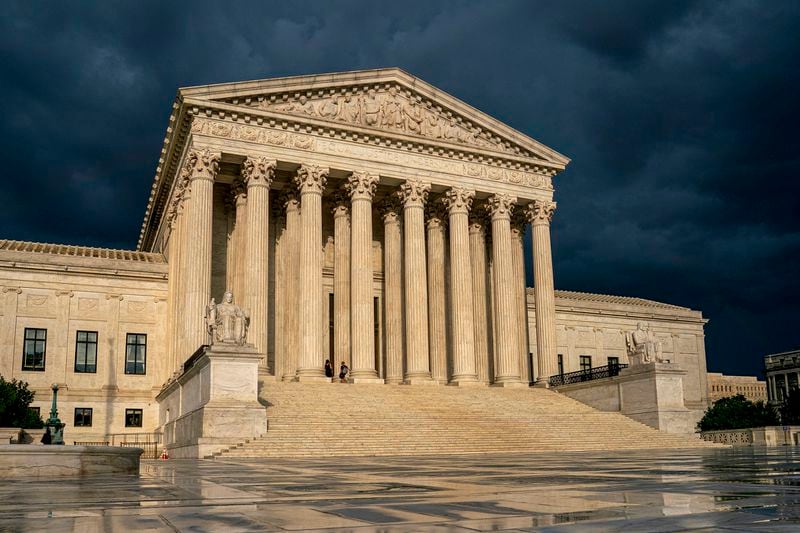 FILE - The Supreme Court is seen under stormy skies in Washington, June 20, 2019. In the coming days, the Supreme Court will confront a perfect storm mostly of its own making, a trio of decisions stemming directly from the Jan. 6, 2021 attack on the U.S. Capitol. (AP Photo/J. Scott Applewhite, File)