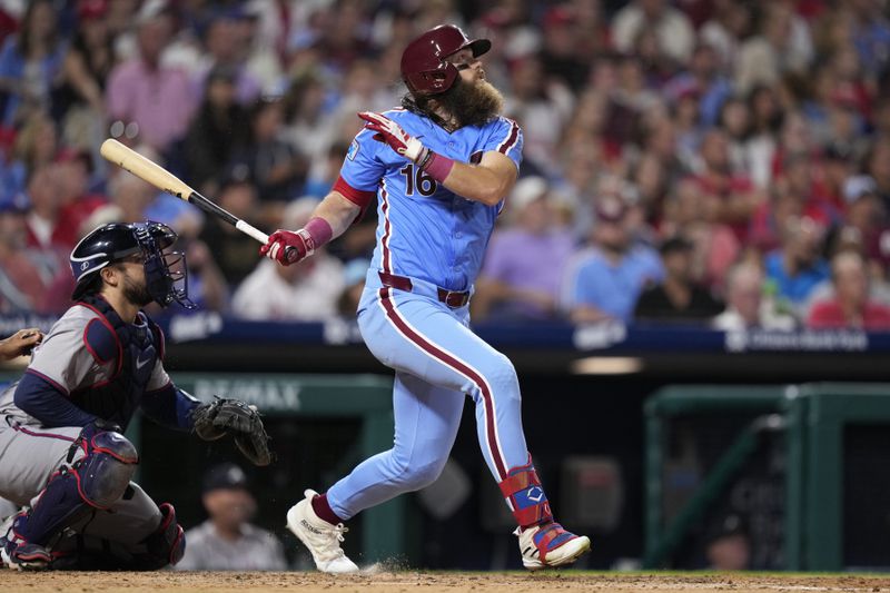 Philadelphia Phillies' Brandon Marsh watches after hitting a three-run home run against Atlanta Braves pitcher Charlie Morton during the sixth inning of a baseball game, Thursday, Aug. 29, 2024, in Philadelphia. (AP Photo/Matt Slocum)