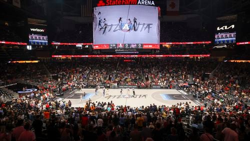 Indiana Fever guard Caitlin Clark (22) takes the ball up the court against the Atlanta Dream in the first half at State Farm Arena, Friday, June 21, 2024, in Atlanta. (Jason Getz / AJC)