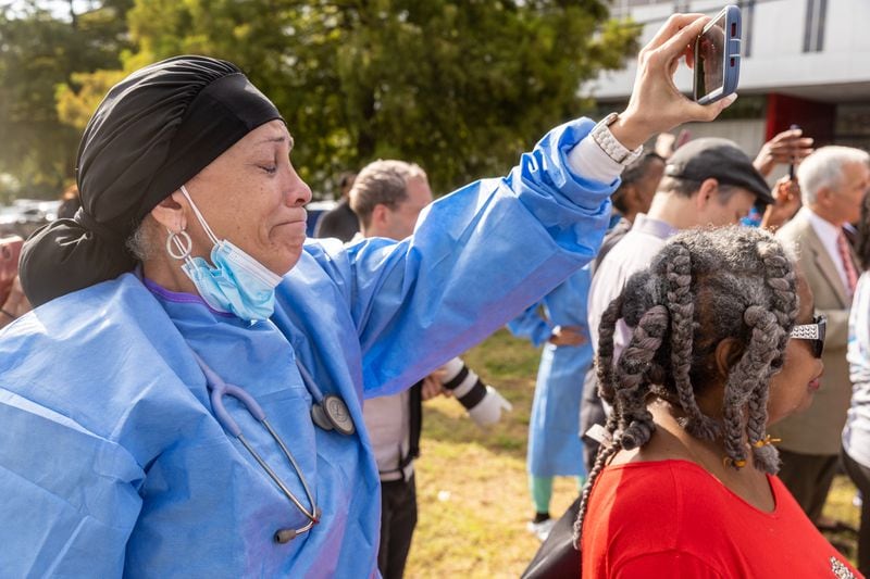 WellStar Atlanta Medical Center nurse Melody Reddington becomes emotional listening to Stacey Abrams talk at a press conference outside the hospital Friday, Sep. 02, 2022. Steve Schaefer/steve.schaefer@ajc.com)