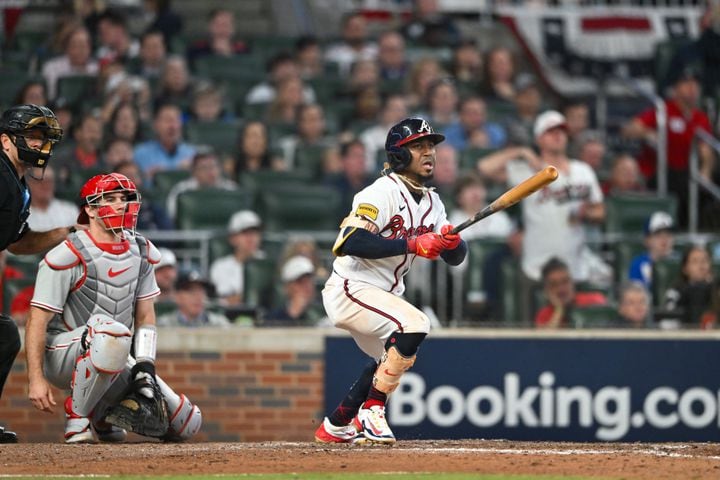 Atlanta Braves’ Ozzie Albies (1) singles against the Philadelphia Phillies before Ronald Acuna Jr. (13) scored on an error during the sixth inning of NLDS Game 2 in Atlanta on Monday, Oct. 9, 2023.   (Hyosub Shin / Hyosub.Shin@ajc.com)