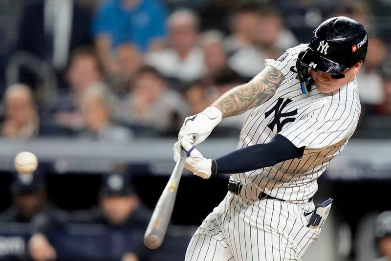 New York Yankees' Alex Verdugo (24) connects for a double to drive in a run against the Kansas City Royals during the seventh inning of Game 1 of the American League baseball division series, Saturday, Oct. 5, 2024, in New York. (AP Photo/Frank Franklin II)