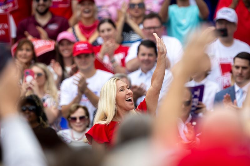 U.S. Rep. Marjorie Taylor Greene, a Rome Republican, greets the crowd at a rally in Lindale on Friday. 