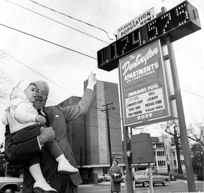 Then-Atlanta Mayor Ivan Allen Jr. shows (or rather tries to show) Scott Silvis, 16 months, the then-new electric sign at the Darlington Apartments, 2025 Peachtree Road, that shows a running count of Atlanta's population, in March 1965. The count at the time the mayor threw the switch was 1,174,575. (Charles Pugh/AJC staff) You'll find more photos of places in and around Atlanta from our archive at our Flachback Photos page.