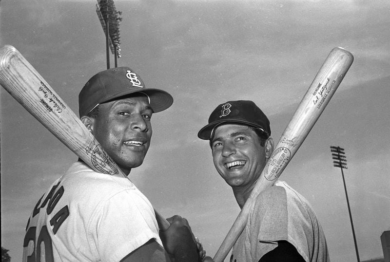 FILE - St. Louis Cardinals' Orlando Cepeda, left, and Boston Red Sox's Carl Yastrzemski pose for a photo in March 1968 in St. Petersburg, Fla. Cepeda, the slugging first baseman nicknamed “Baby Bull” who became a Hall of Famer among the early Puerto Ricans to star in the major leagues, has died. He was 86. The San Francisco Giants and his family announced the death Friday night, June 28, 2024, and a moment of silence was held on the scoreboard at Oracle Park midway through a game against the Los Angeles Dodgers. (AP Photo/Harry Hall, File)