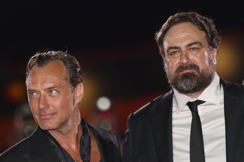 Jude Law, left, and director Justin Kurzel pose for photographers upon arrival for the premiere of the film 'The Order' during the 81st edition of the Venice Film Festival in Venice, Italy, on Saturday, Aug. 31, 2024. (Photo by Vianney Le Caer/Invision/AP)