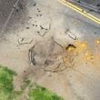 This photo taken from a Kyodo News helicopter shows part of a damaged taxiway at Miyazaki Airport in southwestern Japan, Wednesday, Oct. 2, 2024, after an explosion was reported. (Kyodo News via AP)