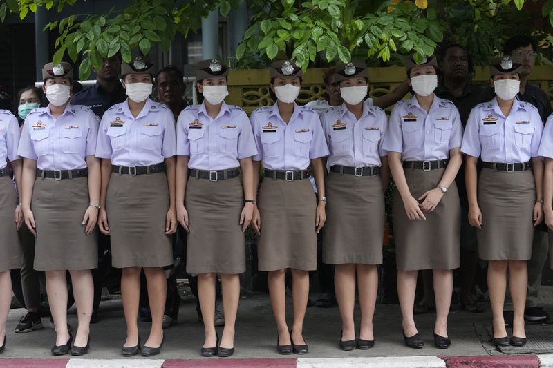 Nurse students pay respect to one of the victims of a school bus fire, at Police hospital in Bangkok, Thailand, Wednesday, Oct. 2, 2024. (AP Photo/Sakchai Lalit)