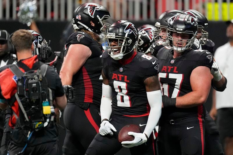 Atlanta Falcons tight end Kyle Pitts (8) reacts after a touchdown catch during the first half of an NFL football game against the Pittsburgh Steelers on Sunday, Sept. 8, 2024, in Atlanta. (AP Photo/John Bazemore)