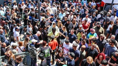 FILE - Thousands of Boeing machinists make their way to the exits to cast their vote after the "stop work meeting" and strike sanction at T-Mobile Park in Seattle, July 17, 2024. (Kevin Clark/The Seattle Times via AP, File)