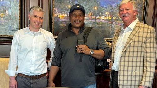 Sporting legend Vincent Edward "Bo" Jackson (center) with his Marietta-based attorneys David P. Conley (left) and Robert D. Ingram. On Feb. 2, Jackson was awarded just over $21 million by a Cobb County judge in his civil extortion case against his niece and nephew.