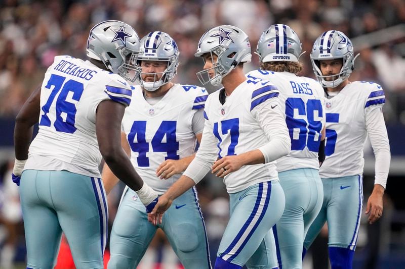 Dallas Cowboys place kicker Brandon Aubrey (17) reacts with teammate after kicking a field goal against the New Orleans Saints during the first half of an NFL football game, Sunday, Sept. 15, 2024, in Arlington, Texas. (AP Photo/Tony Gutierrez)