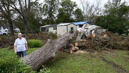 Linda Hall shows damages caused by Hurricane Helene at her daughter’s home, Tuesday, October 1, 2024, in Alapaha. Recovery efforts continue Sunday across Georgia’s 159 counties after Helene barreled through the state, causing catastrophic damage, flooding and at least 25 deaths. More than 400,000 people were still without power statewide after Helene entered South Georgia as a Category 2 hurricane around 1 a.m. Friday. Homes were destroyed, and neighborhoods were flooded across the state. (Hyosub Shin / AJC)