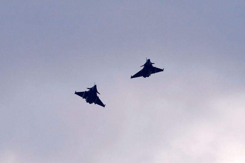 FILE - Two French Dassault Rafale fighter jets fly after a signing ceremony between French President Emmanuel Macron and Croatia's Prime Minister Andrej Plenkovic in Zagreb, Croatia, Thursday, Nov. 25, 2021. Macron starts a two-day state visit to Serbia on Thursday, Aug. 29, 2024 with the focus on a possible sale of 12 Rafale multi-purpose fighter jets. (AP Photo/Darko Vojinovic, File)