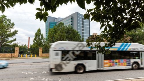 A MARTA bus drives in front of the CDC along Clifton Road in Atlanta on Tuesday, August 2, 2022. (Arvin Temkar / arvin.temkar@ajc.com)