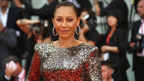 FILE - Singer Mel B poses for photographers upon arrival at the premiere of the film 'The Truth' and the opening gala of the 76th edition of the Venice Film Festival, Venice, Italy, on Aug. 28, 2019. Former Spice Girl Mel B is among dozens of Black Britons urging Britain's Parliament to update the country's equality laws and prohibit Afro hair discrimination. (Photo by Joel C Ryan/Invision/AP, File)