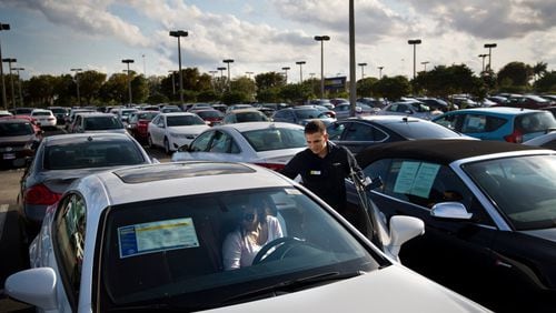 A salesman shows cars at a dealership in Doral, Fla., on March 14, 2017. (Scott McIntyre/The New York Times)