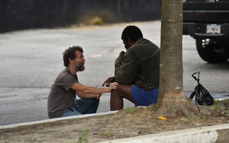 Mathew Reed (left), Mercy Care case manager, encourages his client at Mercy Community Church in Atlanta on Thursday, Aug. 22, 2019. Mercy Care started a street medicine team with one night a week and has expanded the program - to four days/nights a team of nurses and a social workers provide medical and mental health care to people living on the streets. (Hyosub Shin / Hyosub.Shin@ajc.com)