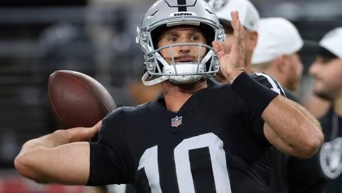 Las Vegas Raiders quarterback Nathan Peterman (10) warms up before a game against the San Francisco 49ers, Friday, Aug. 23, 2024, in Las Vegas. (AP Photo/Ian Maule)