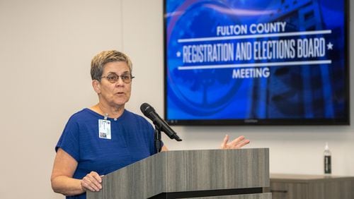 Members of the Fulton County Registration and Elections Board including Chairperson Cathy Woolard addresses the crowd on Tuesday, June 18, 2024.  (Jenni Girtman for The Atlanta Journal-Constitution)