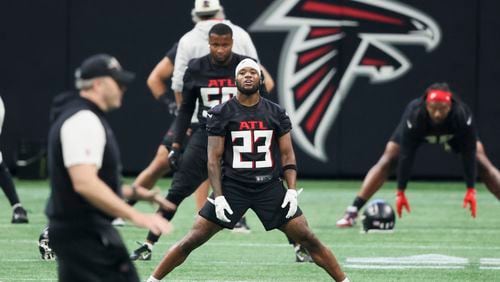 Falcons defensive back Darren Hall (23) stretches with teammates during minicamp at Mercedes-Benz Stadium, Tuesday, June 13, 2023, in Atlanta. (Jason Getz / Jason.Getz@ajc.com)