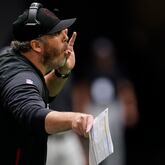 Atlanta Falcons head coach Arthur Smith speaks to players during the second half of an NFL football game against the Washington Football Team, Sunday, Oct. 3, 2021, in Atlanta. (AP Photo/John Bazemore)