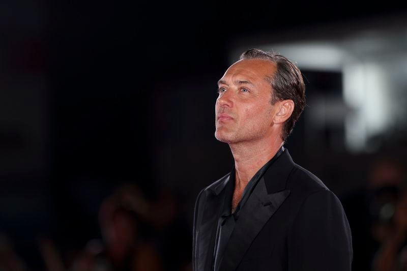 Jude Law poses for photographers upon arrival for the premiere of the film 'The Order' during the 81st edition of the Venice Film Festival in Venice, Italy, on Saturday, Aug. 31, 2024. (Photo by Vianney Le Caer/Invision/AP)