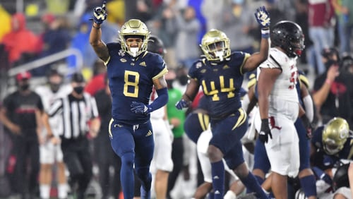 October 9, 2020 Atlanta - Georgia Tech's defensive back Tobias Oliver (8) and Georgia Tech's linebacker Quez Jackson (44) react after  Georgia Tech's defensive lineman Jordan Domineck (not pictured) recovered a fumble during the second half of an NCAA college football game at Georgia Tech's Bobby Dodd Stadium in Atlanta on Friday, October 9, 2020. Georgia Tech's won 46-27 over the Louisville. (Hyosub Shin / Hyosub.Shin@ajc.com)