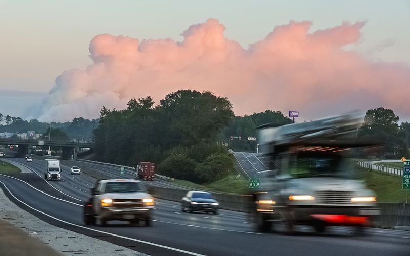 The large plume of smoke from a  chemical plant fire on Sunday is still visible from I-20 eastbound near West Avenue in Conyers on Monday morning.