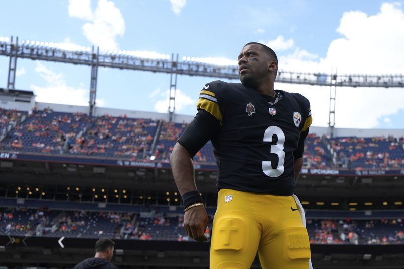 Pittsburgh Steelers quarterback Russell Wilson (3) warms up before an NFL football game against the Denver Broncos, Sunday, Sept. 15, 2024, in Denver. (AP Photo/Jack Dempsey)