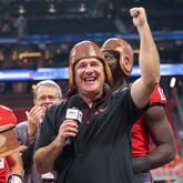 Georgia coach Kirby Smart celebrates with the old leather helmet after their win against Clemson at Mercedes-Benz Stadium, on Saturday, Aug. 31, 2024, in Atlanta. Georgia won 34-3. (Jason Getz / AJC)