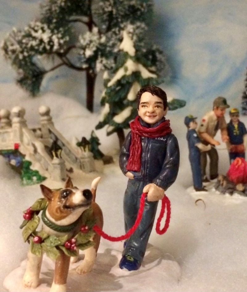 Bill Torpy's sister had this figurine of his son Michael walking Darla made for the family's Christmas village. (Bill Torpy / AJC)