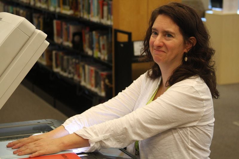 Rocky Mount librarian Traci Thompson says she came back from vacation in 2011 to find the reel-to-reel tape sitting in a beat-up old box on her desk. ERNIE SUGGS / ernie.suggs@ajc.com