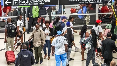 Travelers streamed into Hartsfield-Jackson International Airport on Friday, Aug. 30, 2024, which was expected to be the busiest day of the Labor Day travel period. (John Spink/AJC)