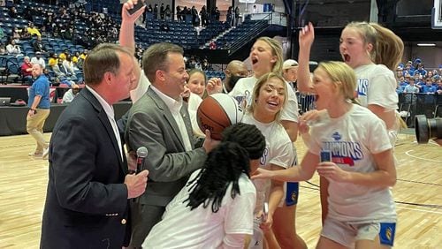 Coach Ed Wilson and the Lake Oconee Academy players celebrate their 45-29 victory over Hancock Central in the Class A Public championship game on Wednesday, March 9, 2022, at the Macon Coliseum.